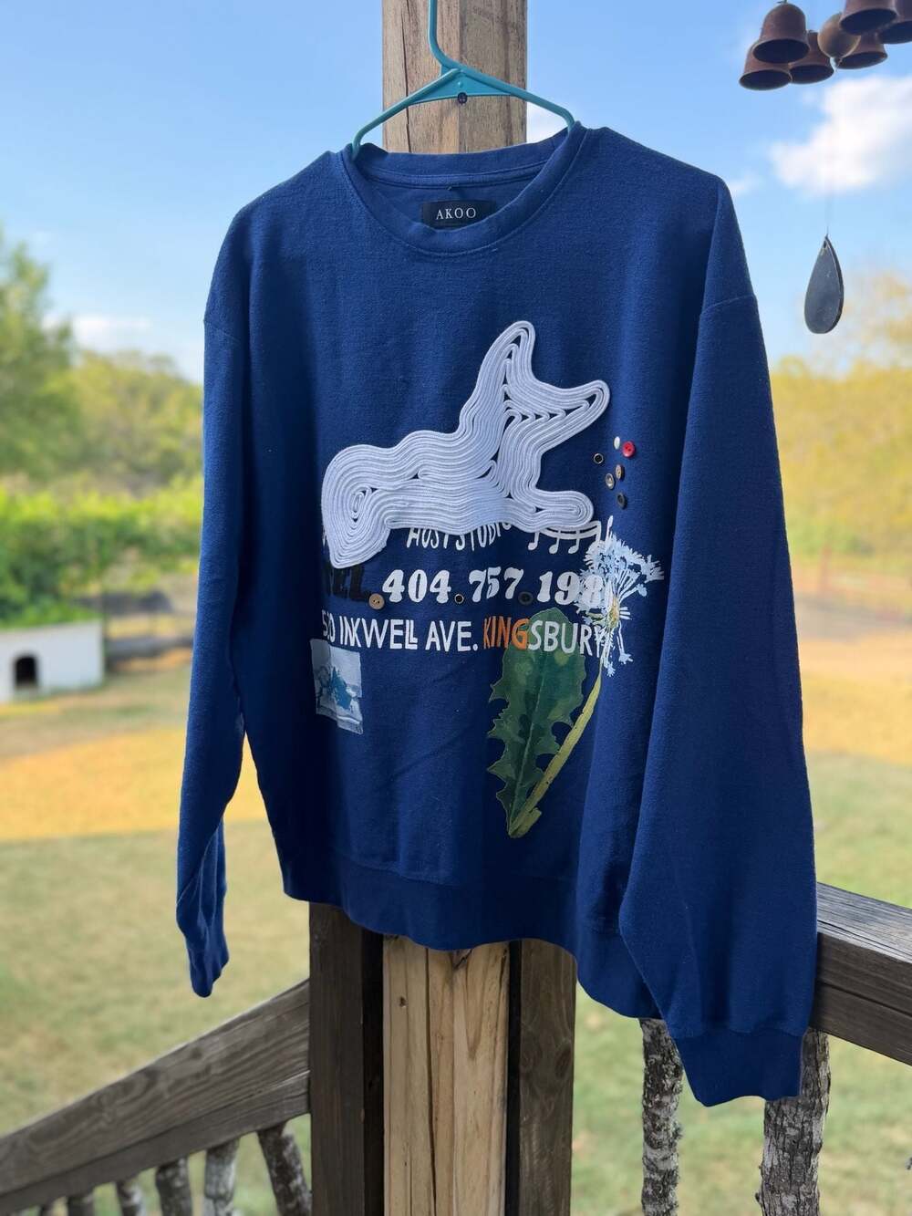 AKOO Blue Graphic Crewneck Sweatshirt with Cord Art and Button Detail